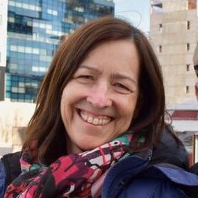 Robin smiling warmly in a bright, welcoming setting, conveying a sense of calm and encouragement